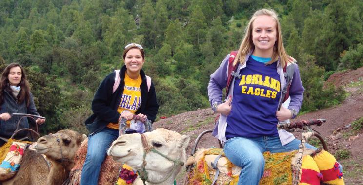 Ashland University study abroad students sitting on camels