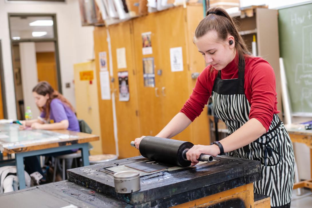 Printmaking student preparing a print plate